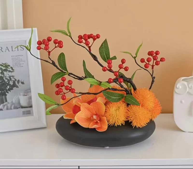 Centrepiece sophistiqué – Magnolias et fruits rouges